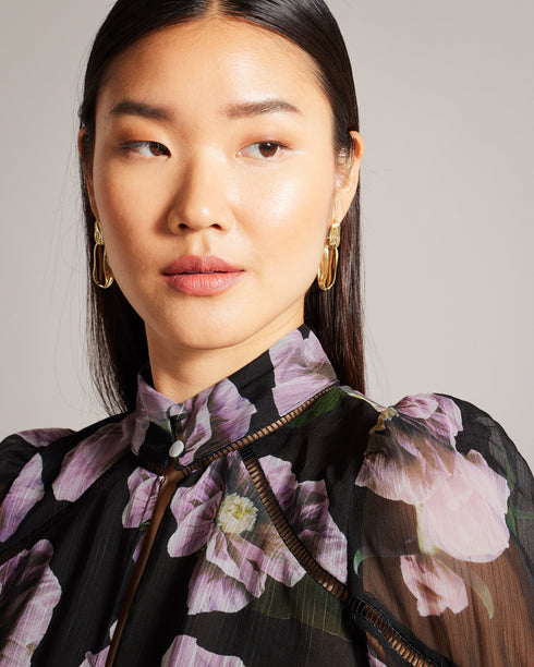 THEERA-Tops-Introducing the stunning THEERA blouse, a masterpiece of texture and print. Its textured fabric and photographic floral print are a feast for the eyes, while the stand collar with a keyhole cut-out add a touch of intrigue. With button fastening and delicate ladder lace inserts, this blouse will capture attention wherever you go. Textured blouse Photographic floral print Stand collar with keyhole cut-out Button fastening Ladder lace inserts Blouson sleeves Lined body- Ted Baker Romania